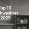 Modern stainless steel dishwasher open with clean dishes inside, against a faded Union Jack flag background and 'Top 10 Dishwashers 2025' text above.